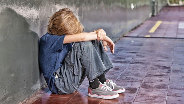 Child sitting alone against wall in distressed posture showing sadness and emotional withdrawal—illustrating psychological effects of childhood trauma, narcissistic parenting abuse, emotional neglect, toxic family dynamics, childhood anxiety, depression from narcissistic abuse, and long-term impact of parental narcissism on children's mental health Child sitting alone against wall in distressed posture showing sadness and emotional withdrawal—illustrating psychological effects of childhood trauma, narcissistic parenting abuse, emotional neglect, toxic family dynamics, childhood anxiety, depression from narcissistic abuse, and long-term impact of parental narcissism on children's mental health