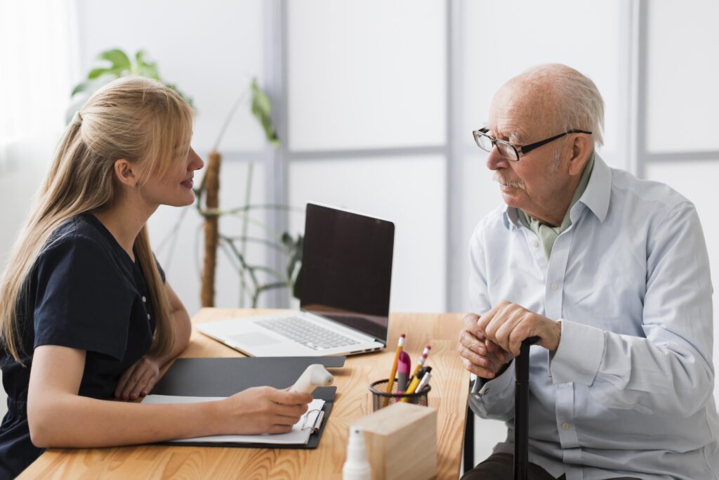 Senior man having a check-up with a nurse