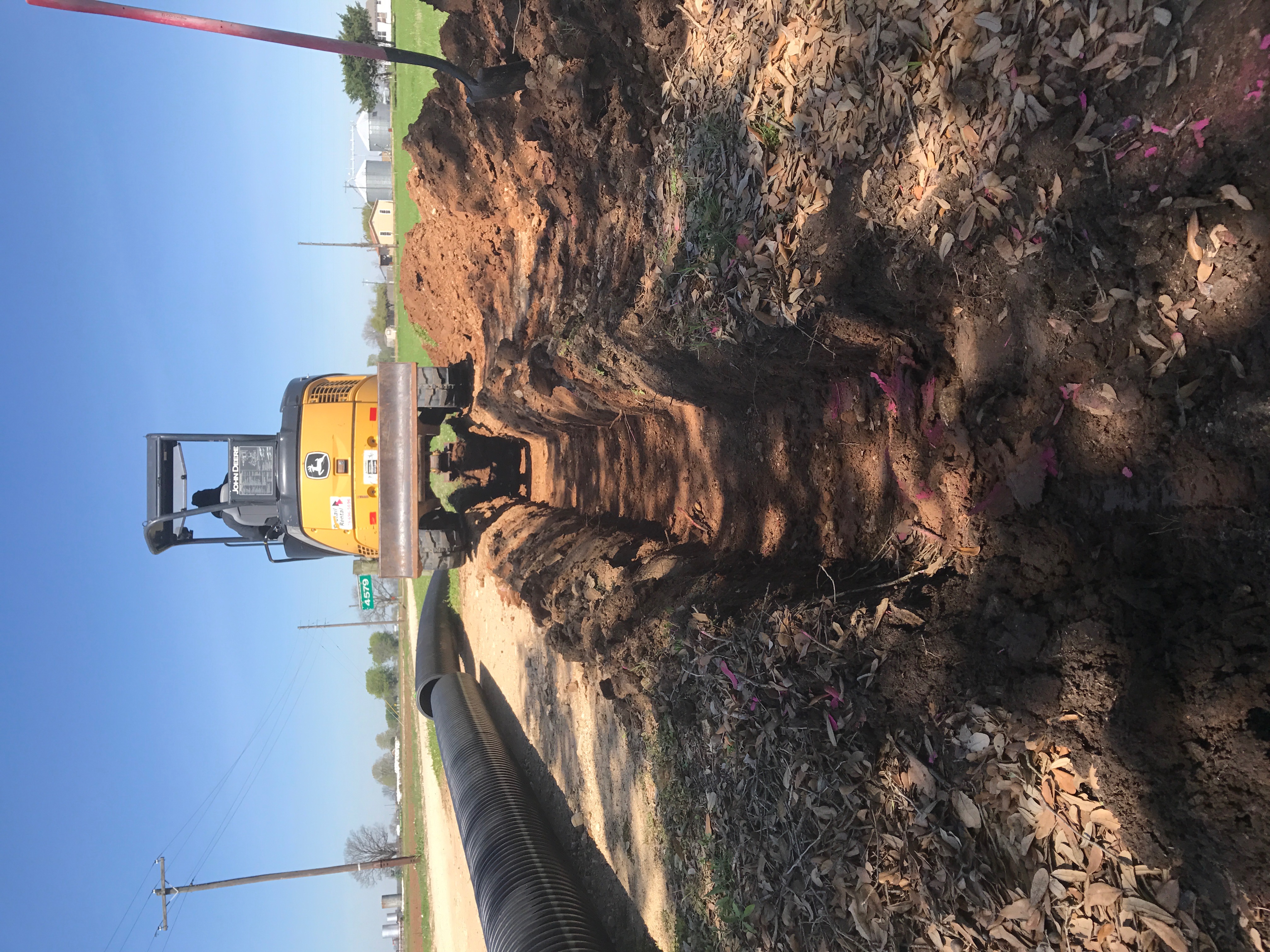 Digging large drainage trench