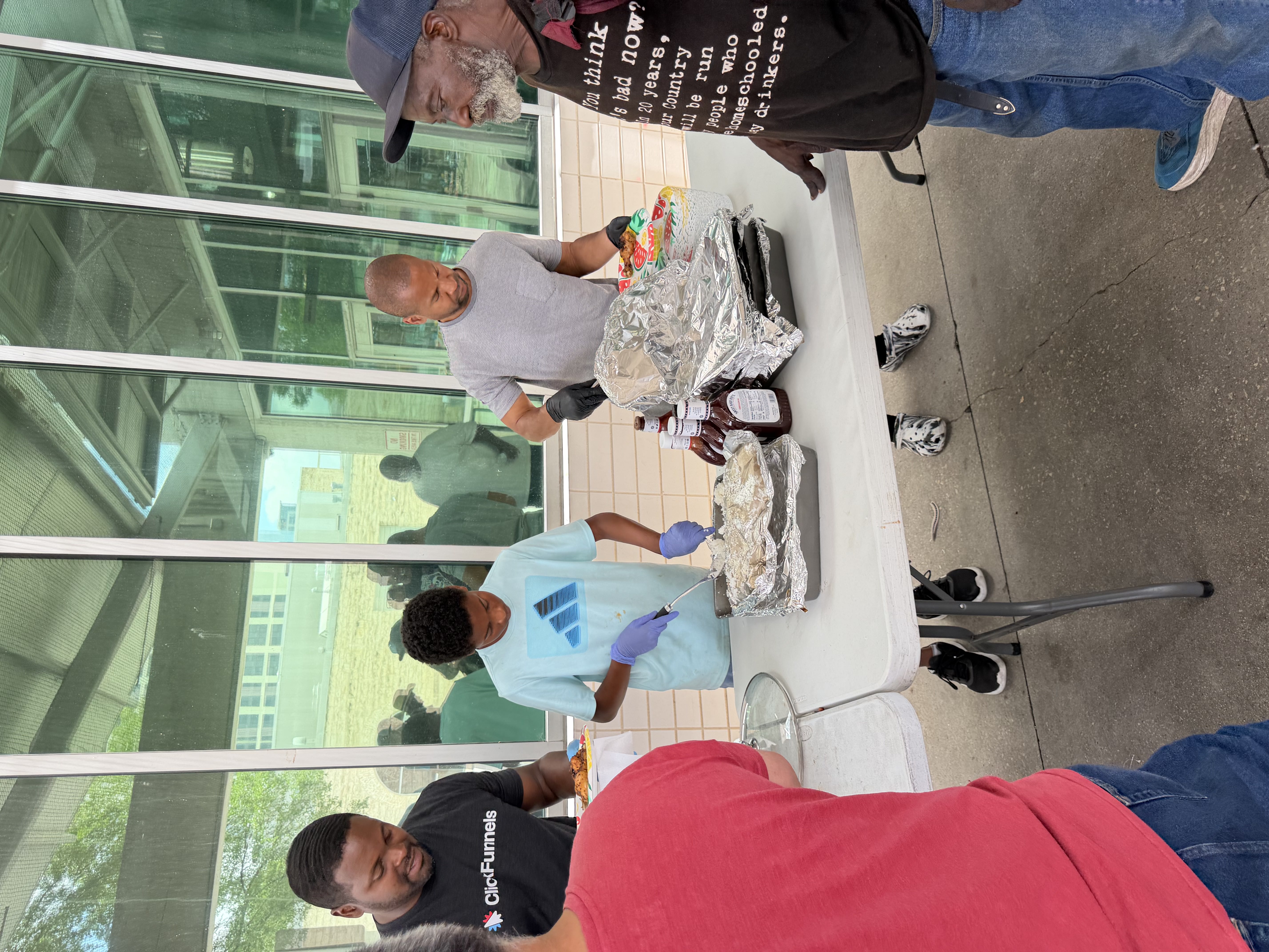 Volunteers serving weekly community meals