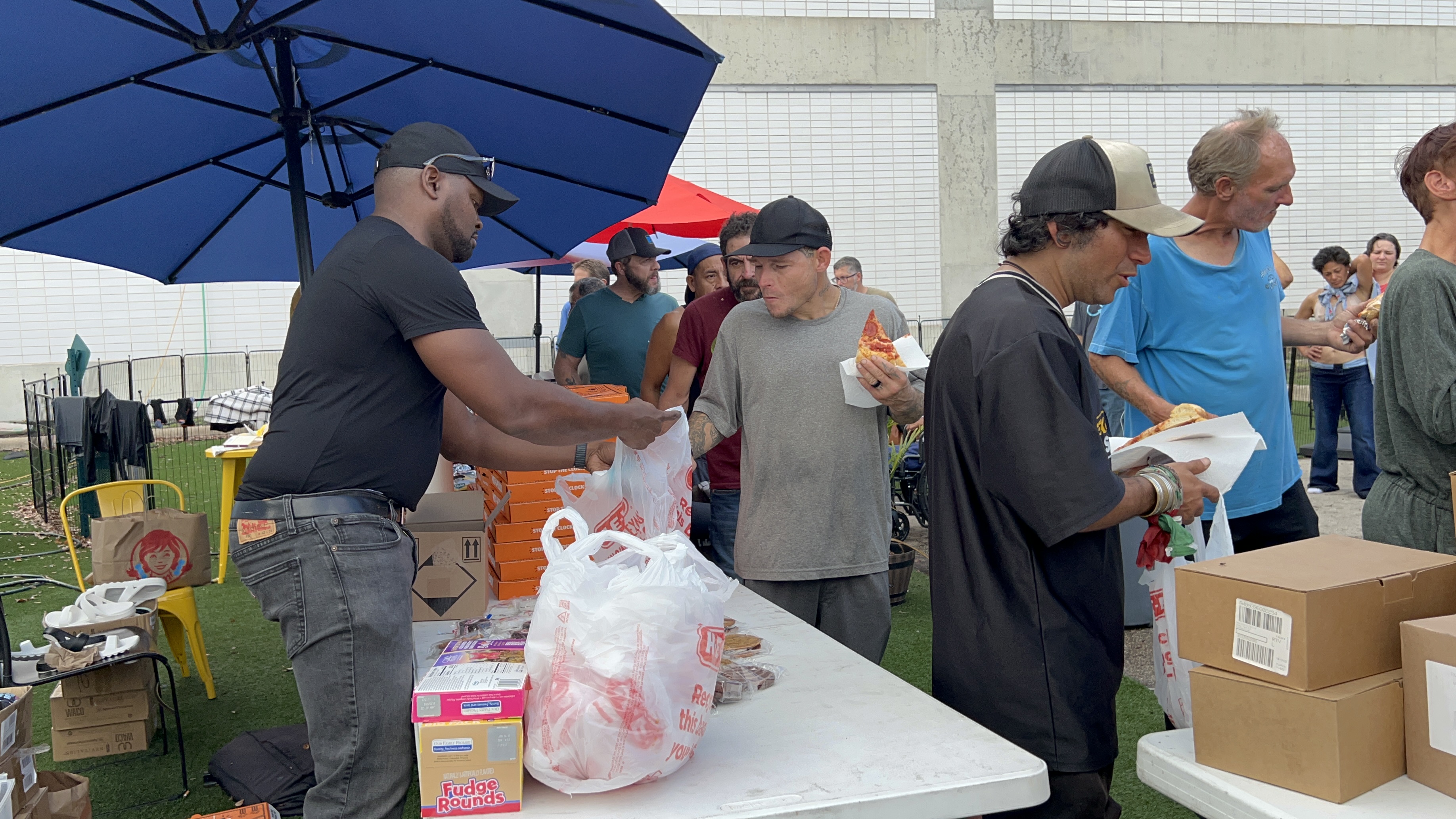 Community food distribution by Jesus Cares Ministry