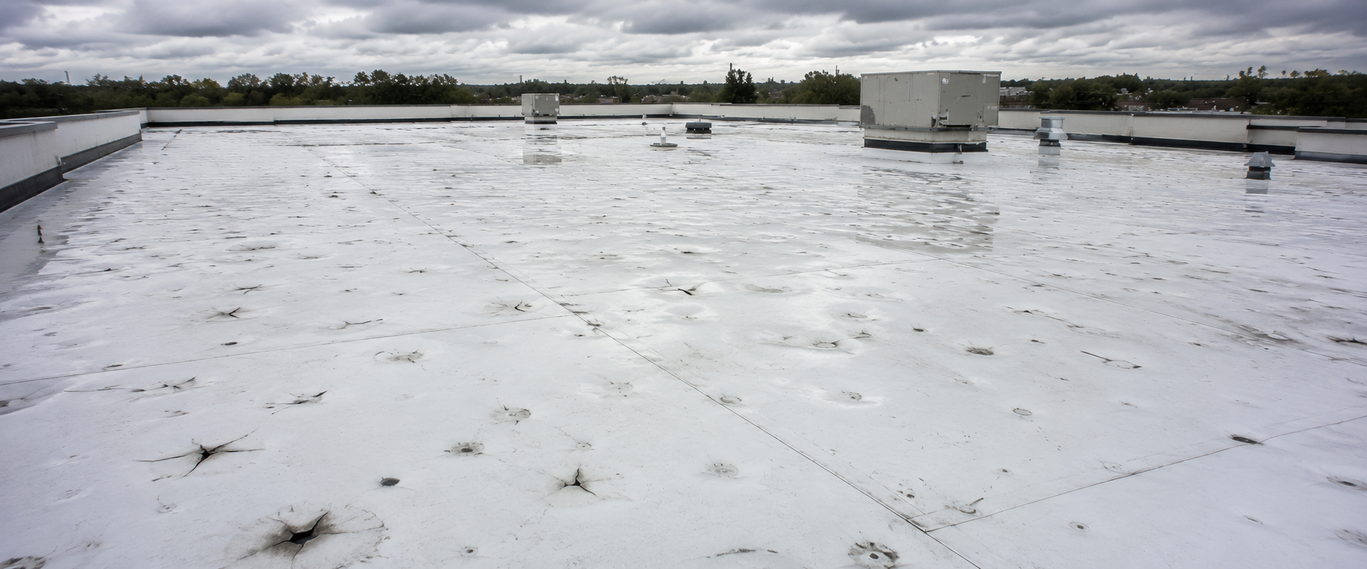 hail damage commercial flat roof Stoughton WI - Badger Roofing of Wisconsin