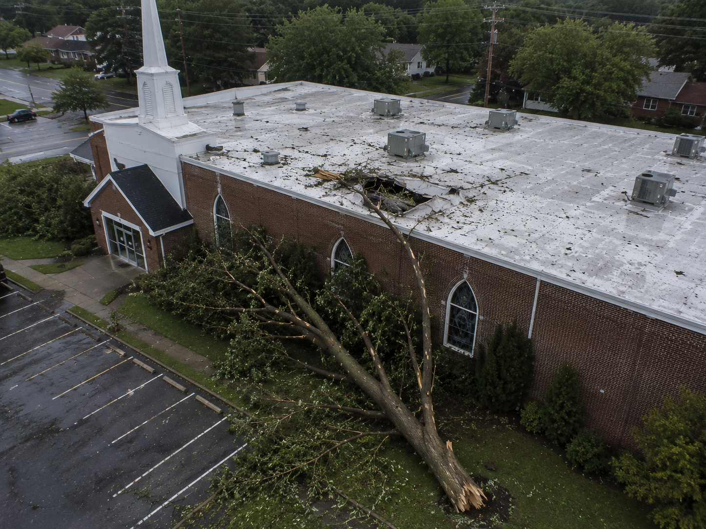 debris impact damage commercial roof Stoughton WI - Badger Roofing of Wisconsin