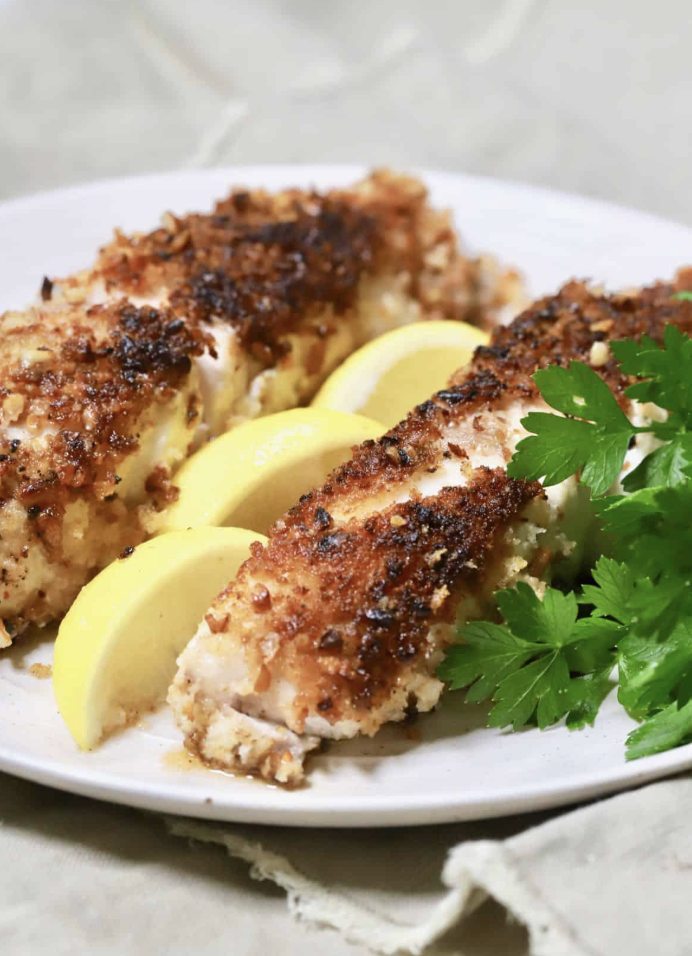 Baked sweet pecan crusted fish fillets with rosemary, 19 grams of protein per portion Baked sweet pecan crusted fish fillets with rosemary, 19 grams of protein per portion