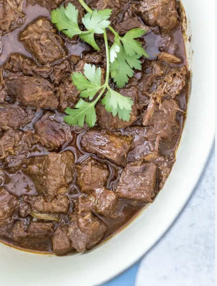 Stovetop braised beef in a rich gochujang broth topped with cilantro, 20g protein per portion Stovetop braised beef in a rich gochujang broth topped with cilantro, 20g protein per portion