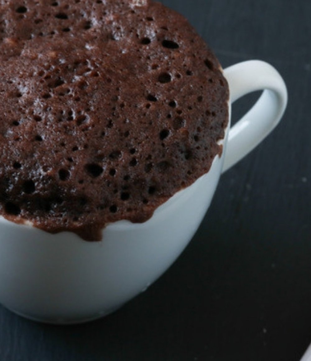 Peanut butter chocolate protein mug cake in a white mug, 28g protein Peanut butter chocolate protein mug cake in a white mug, 28g protein