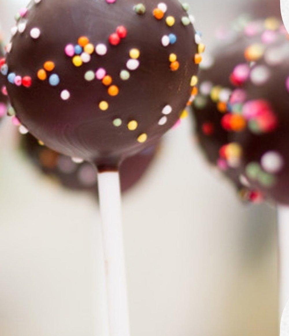 Chocolate dipped protein cake pops with sprinkles, 8g protein per pop Chocolate dipped protein cake pops with sprinkles, 8g protein per pop