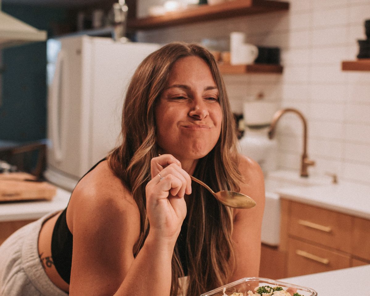 Coach Cam Brown eating a high protein meal in her kitchen