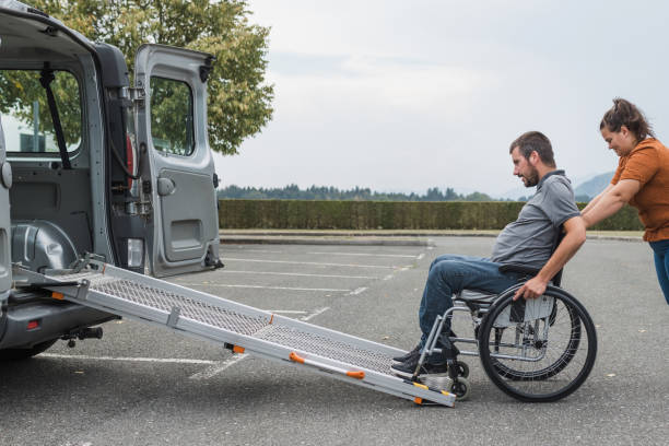  A person entering a vehicle with a ramp visible.