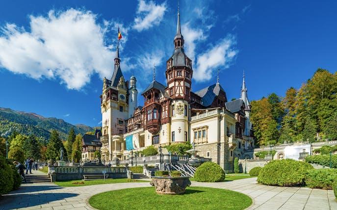 Romania castle architecture surrounded by trees and historic scenery