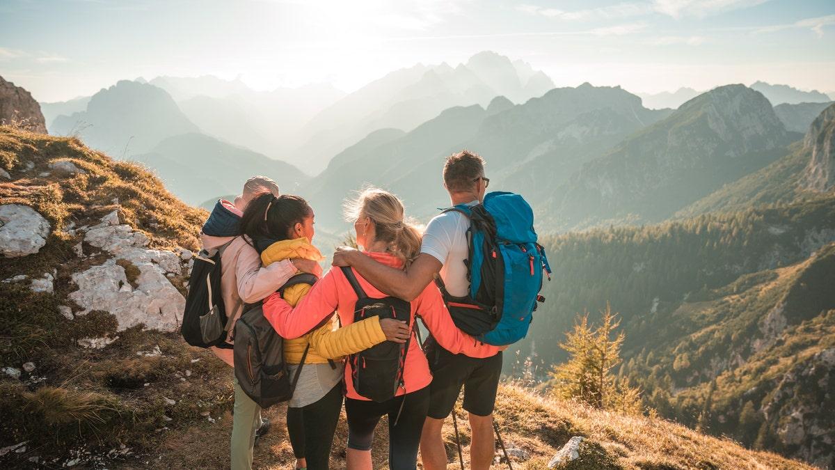 Love Journey travelers sharing a warm moment during an adventure