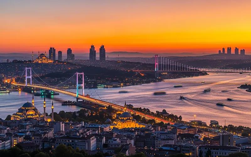 Istanbul skyline glowing over the water