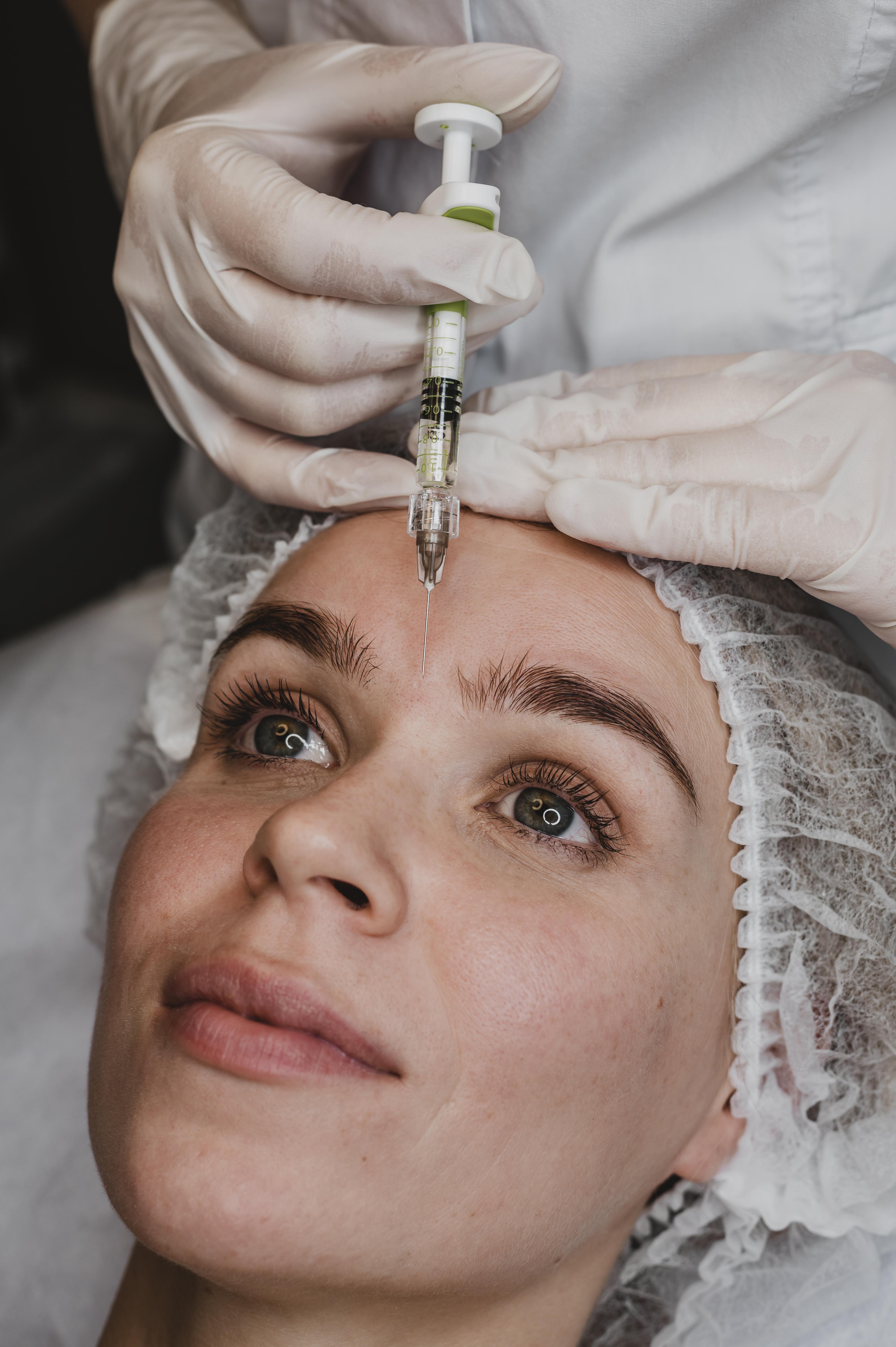 Provider performing a facial injectable treatment