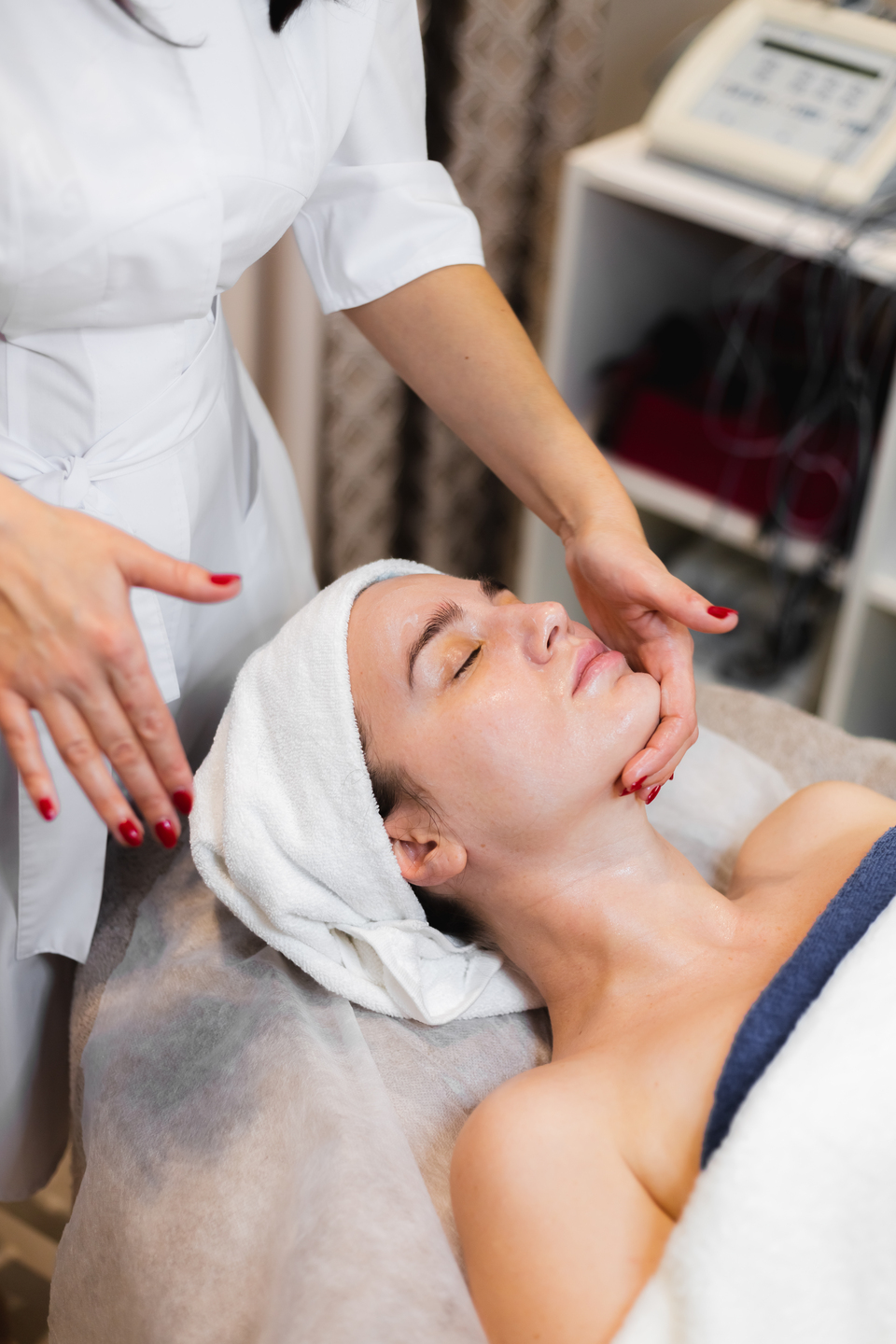 Esthetician performing a facial treatment