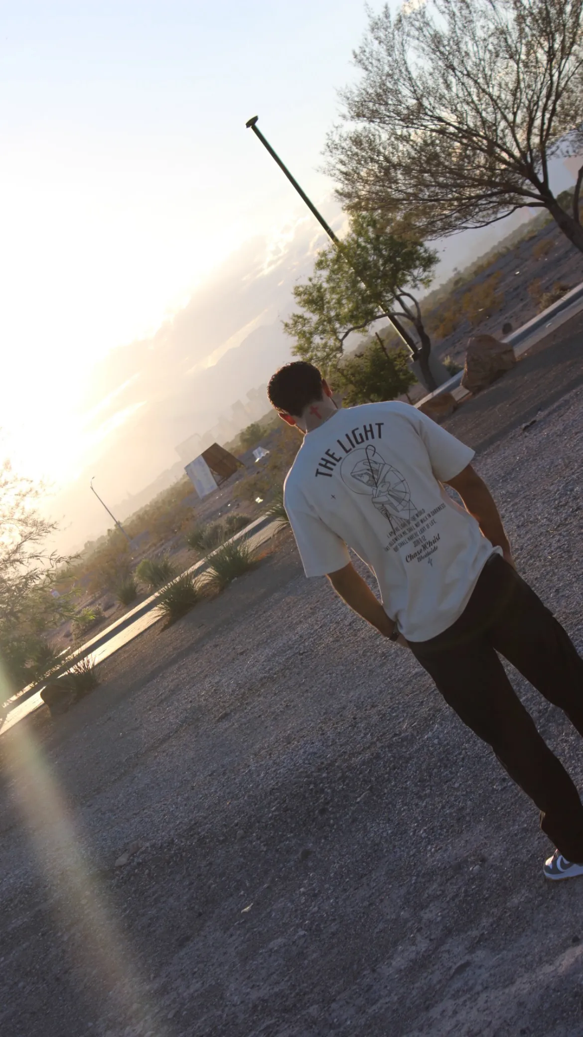 Close detail of a cream tee back print in warm light