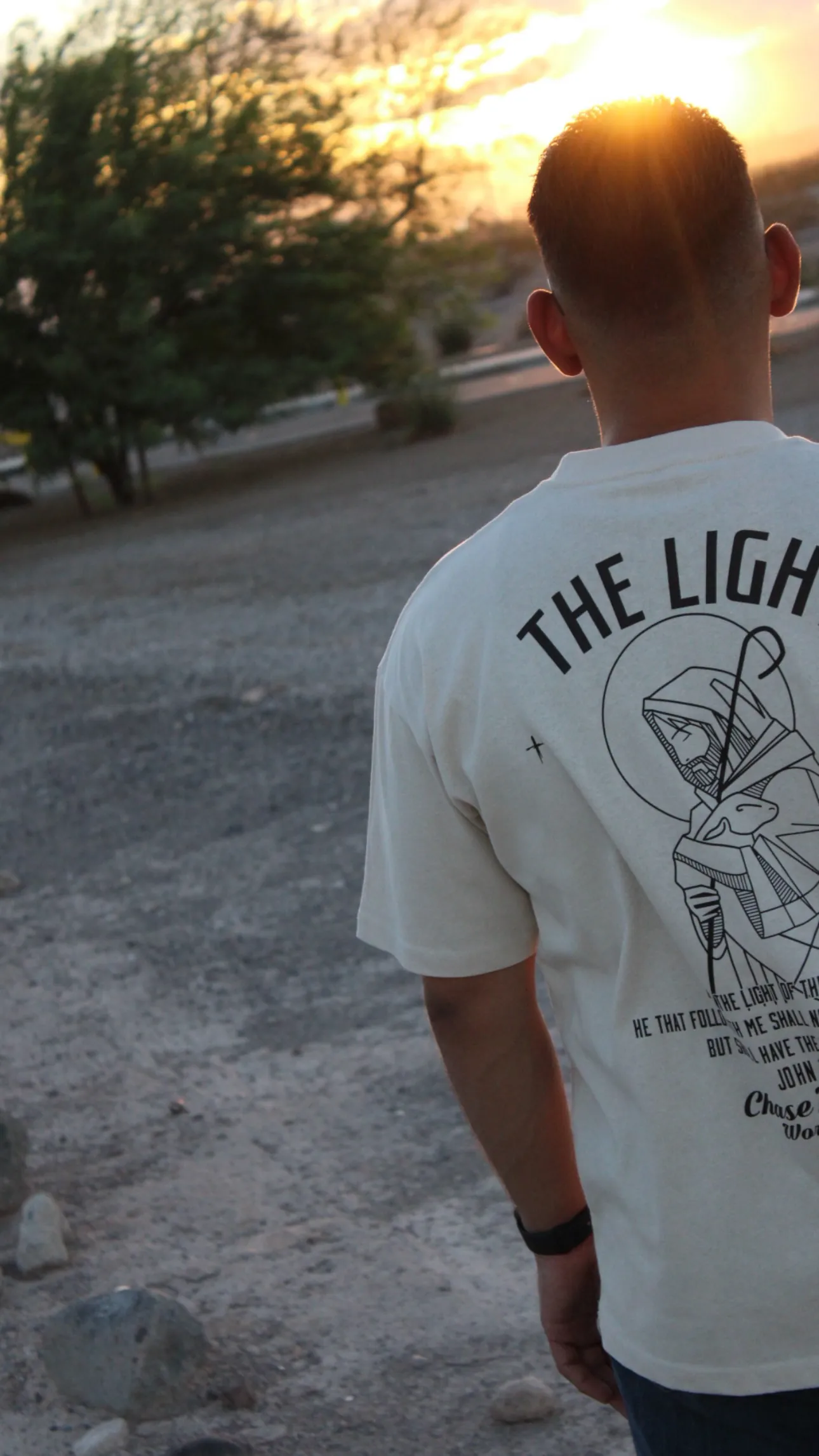 Cream tee shot at golden hour, warm light on light fabric