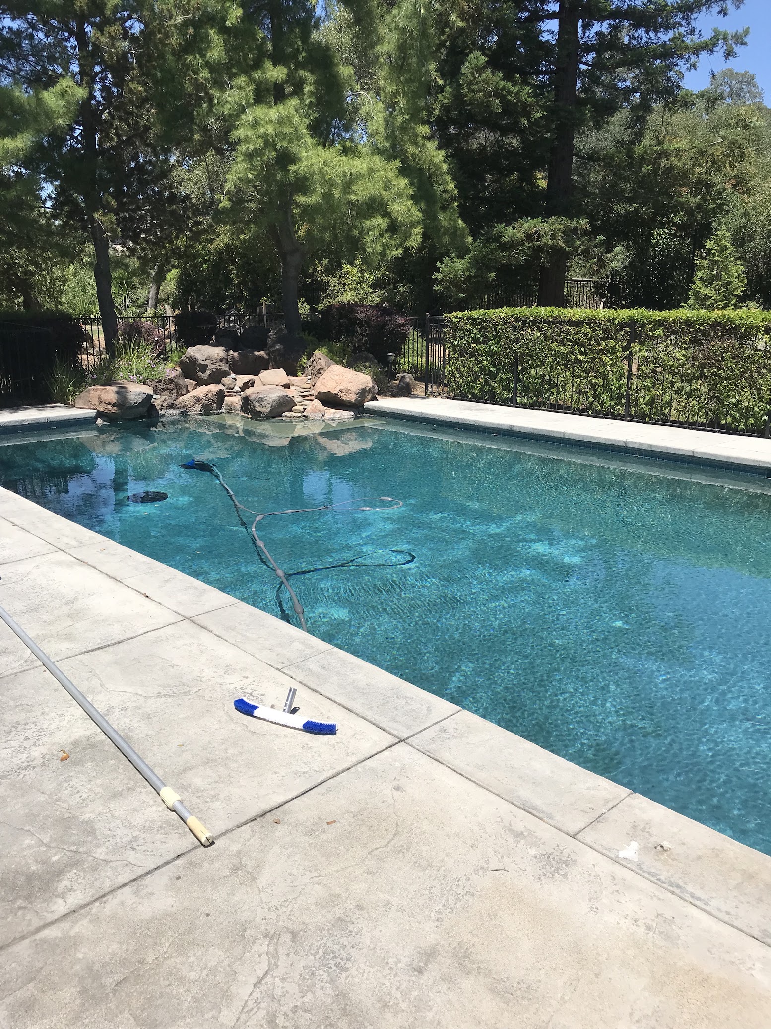 Clean commercial swimming pool with neat deck