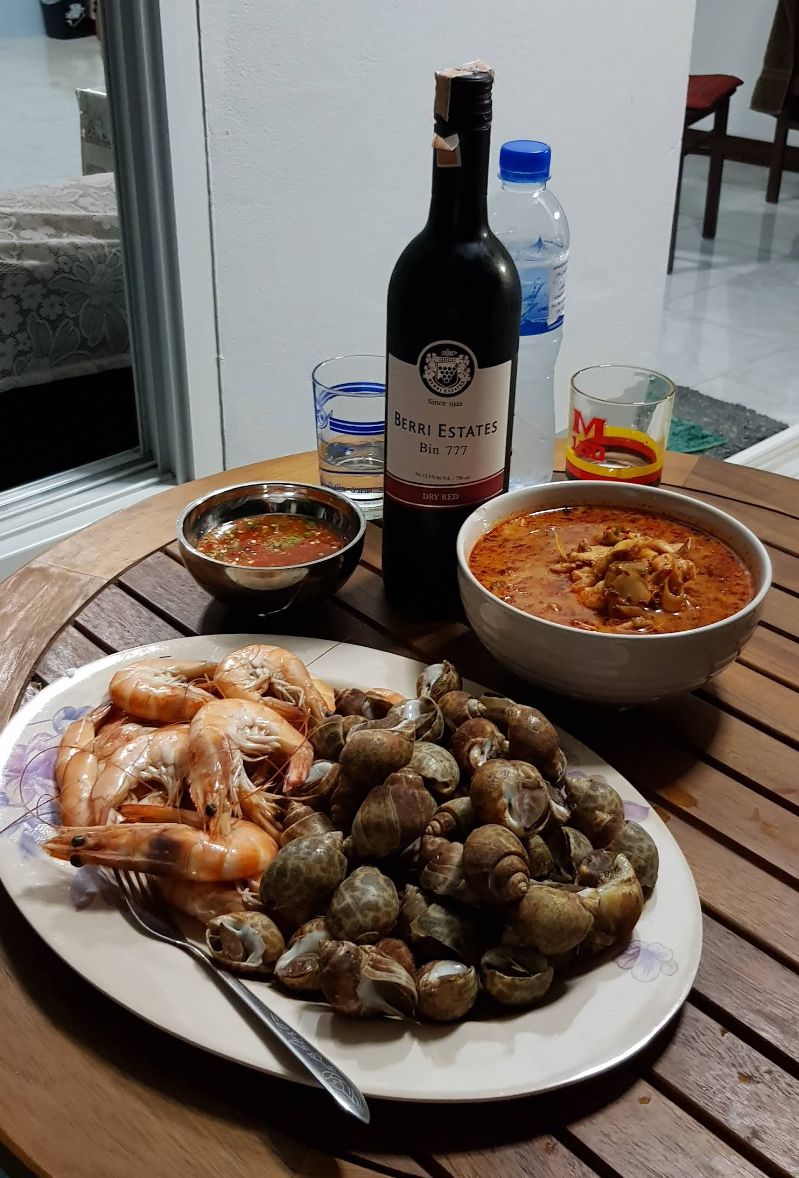 Guests relaxing on pier with sunset at Bang Sare