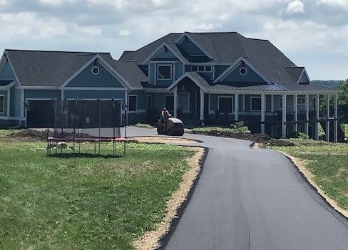 New driveway installation in residential Florida neighborhood.