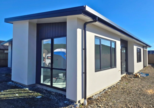 New build in Nelson with textured plaster applied over concrete block.