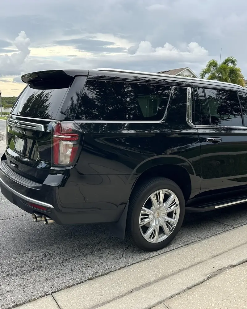Black Chevrolet Suburban parked on a residential street
