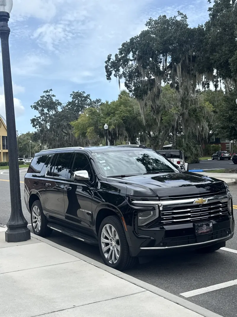 Black Chevrolet Suburban with a Luna Negra plate frame
