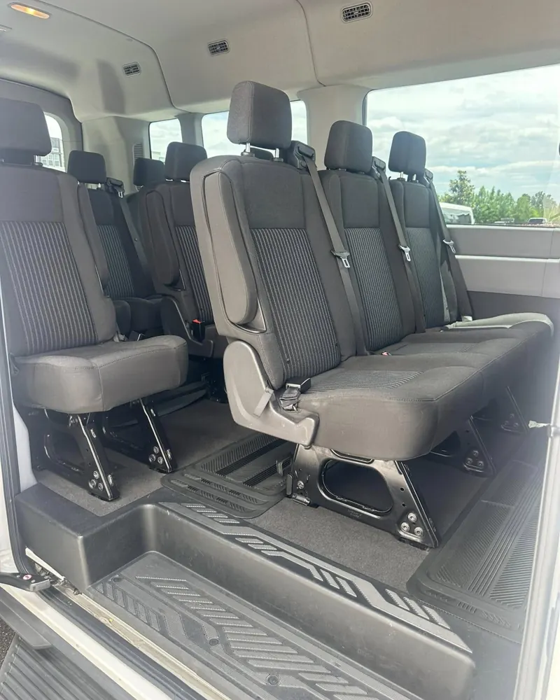 Rows of passenger seats inside a van