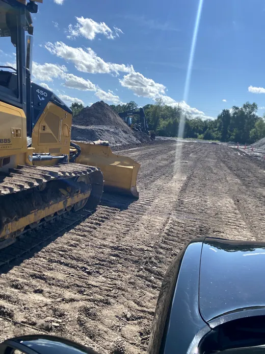 Lot cleared and graded with an excavator before a pour