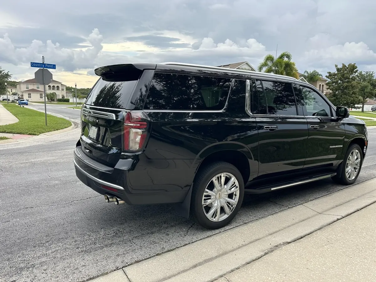 Black Chevrolet Suburban parked on a residential street