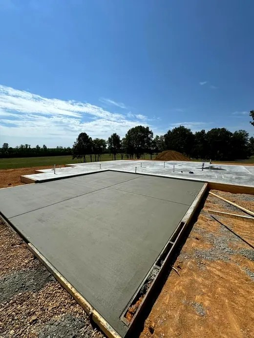 Large slab freshly poured inside wood forms
