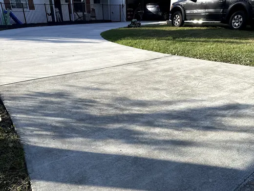 New concrete driveway meeting the street