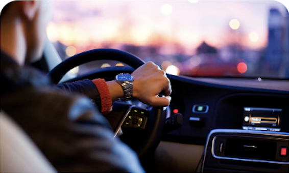 Driver with hands on steering wheel