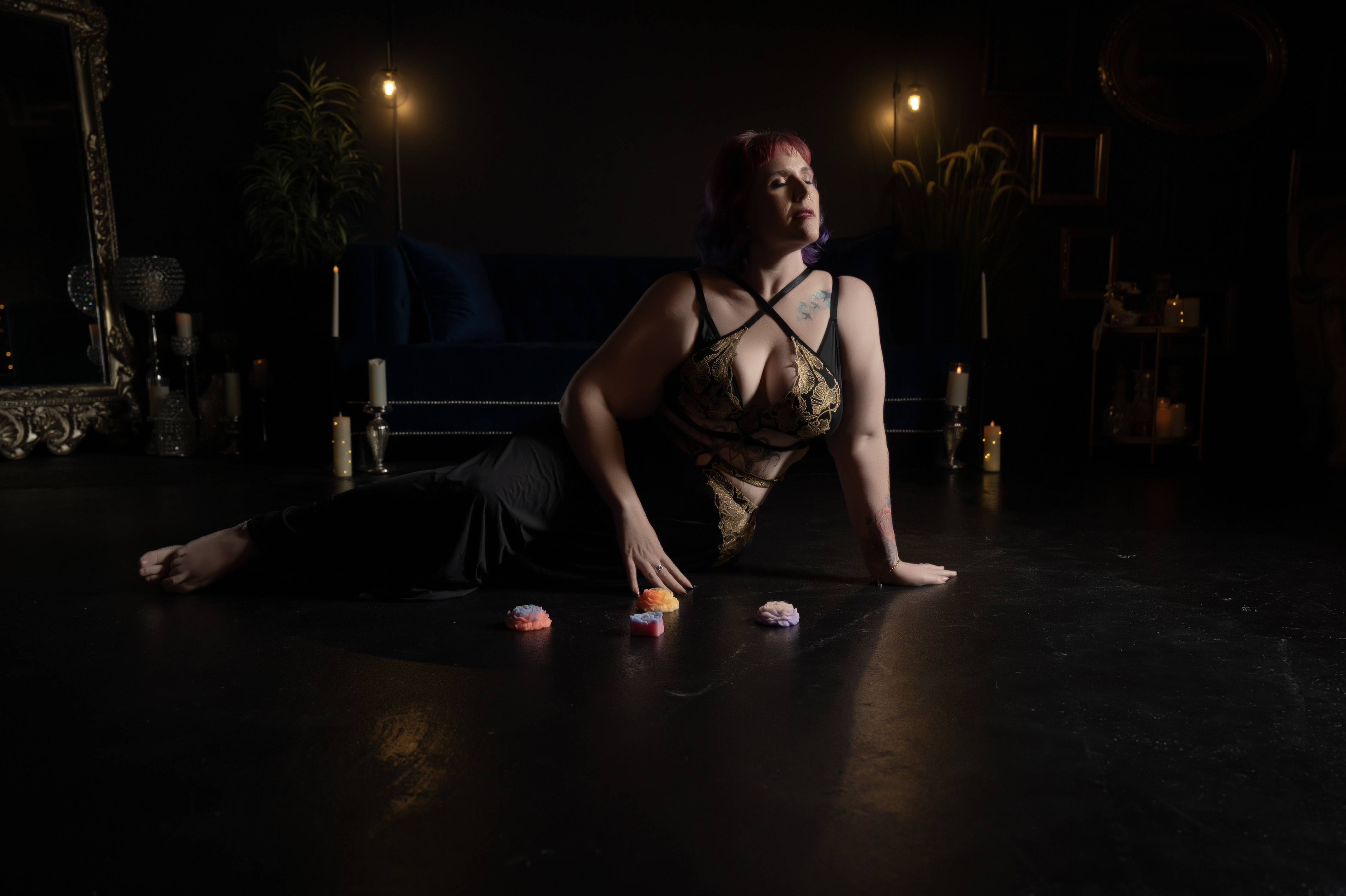 Plus size boudoir portrait with warm studio lighting by Amanda Marquis Photography
