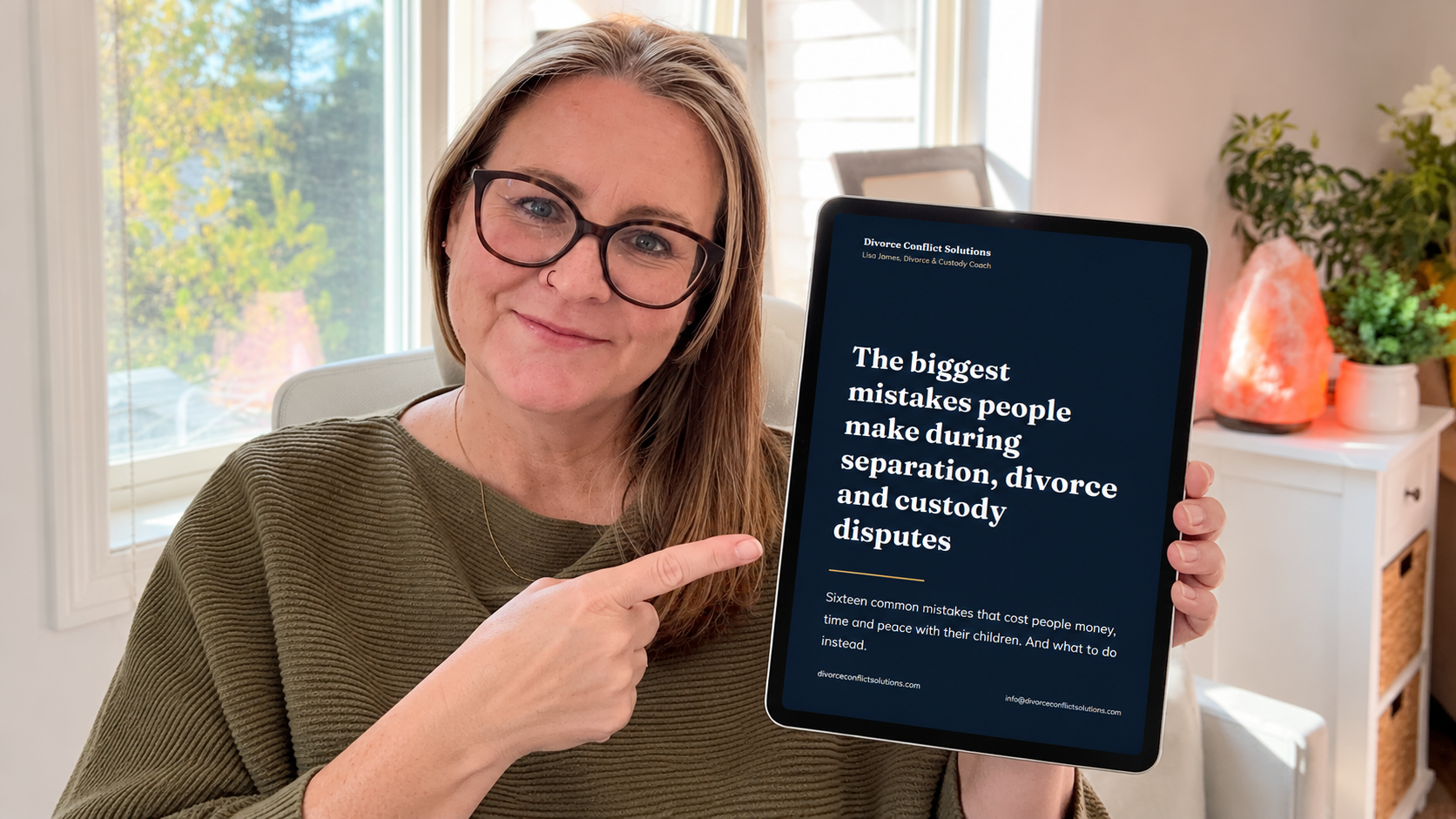 Lisa James holding the free guide