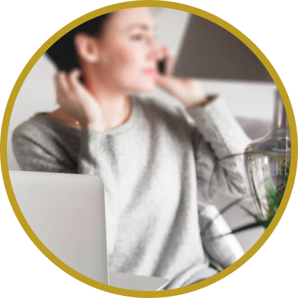 Woman on phone call at her computer