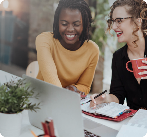 Two women working at computer
