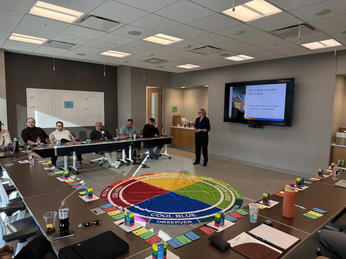 Leadership workshop with participants seated around a training room