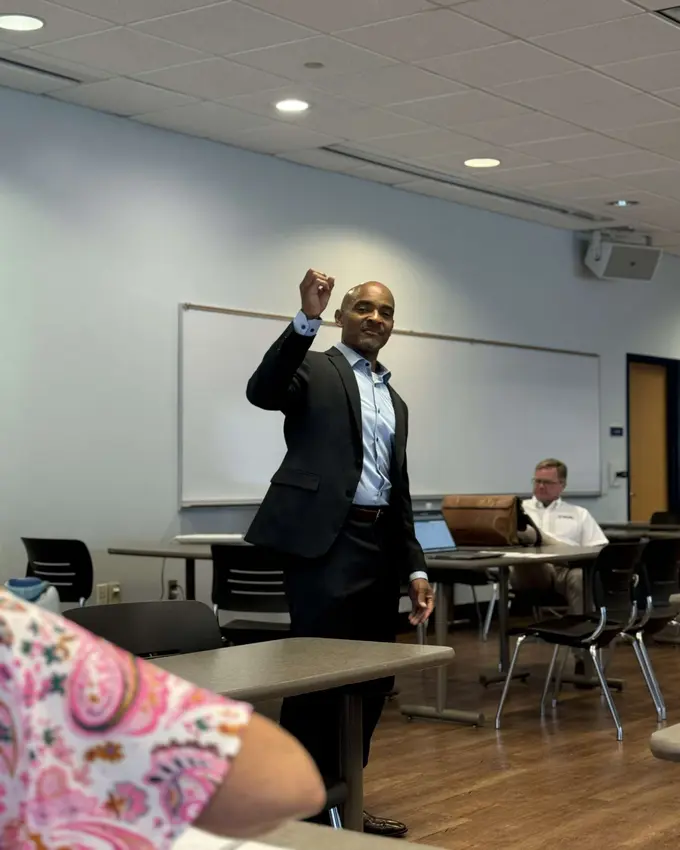 Reggie Carney speaking on a panel