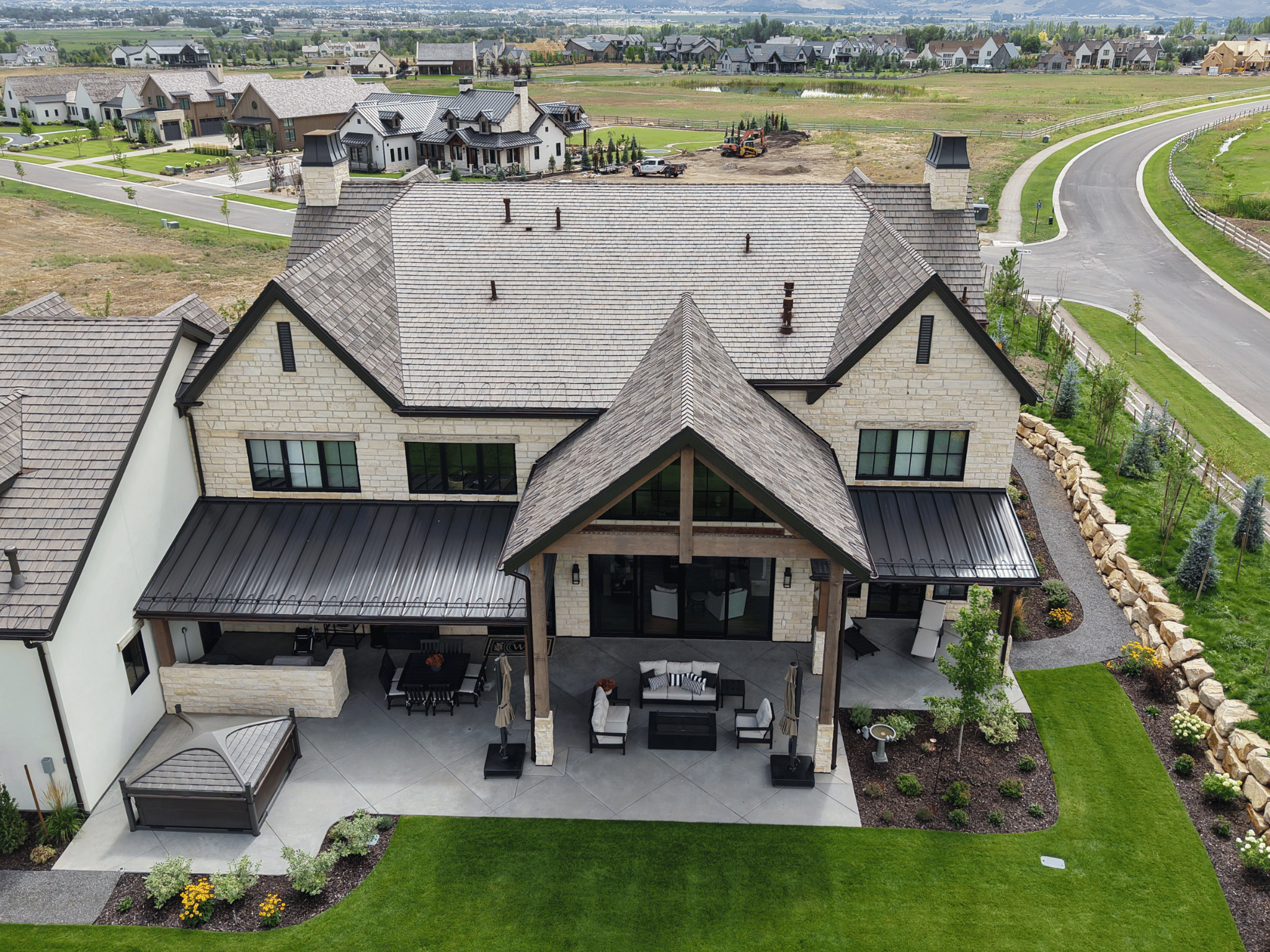 Newly installed metal roof on Utah home with mountain backdrop