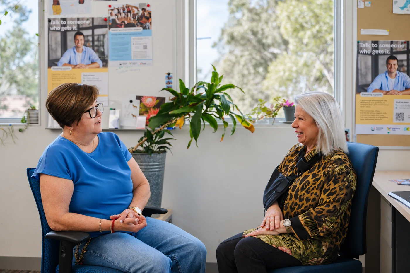 Connie Paglianiti smiling in conversation with another woman at Holstep Health