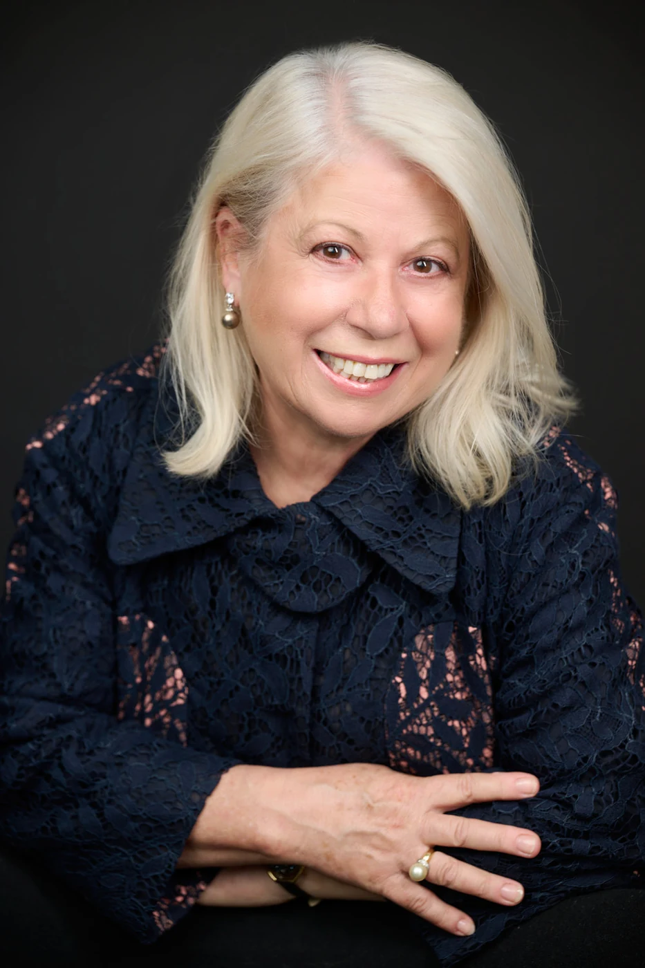 Connie Paglianiti smiling, wearing a navy blouse