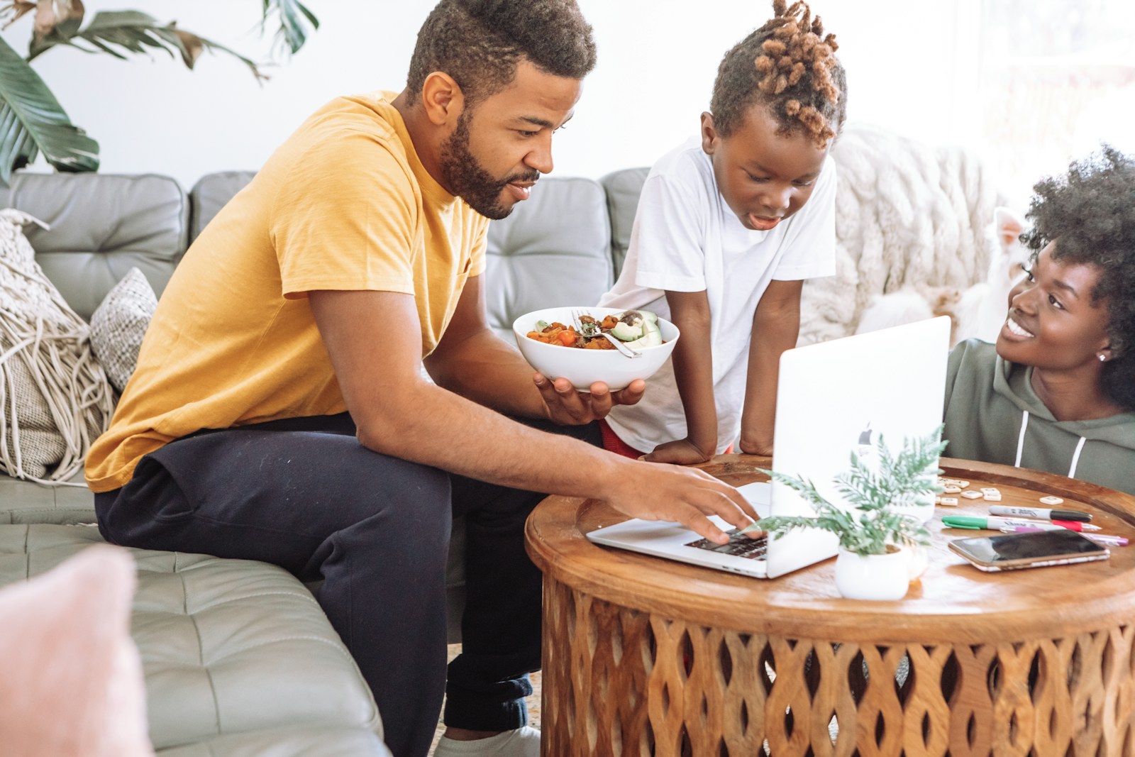 Family using fast home internet together on the couch