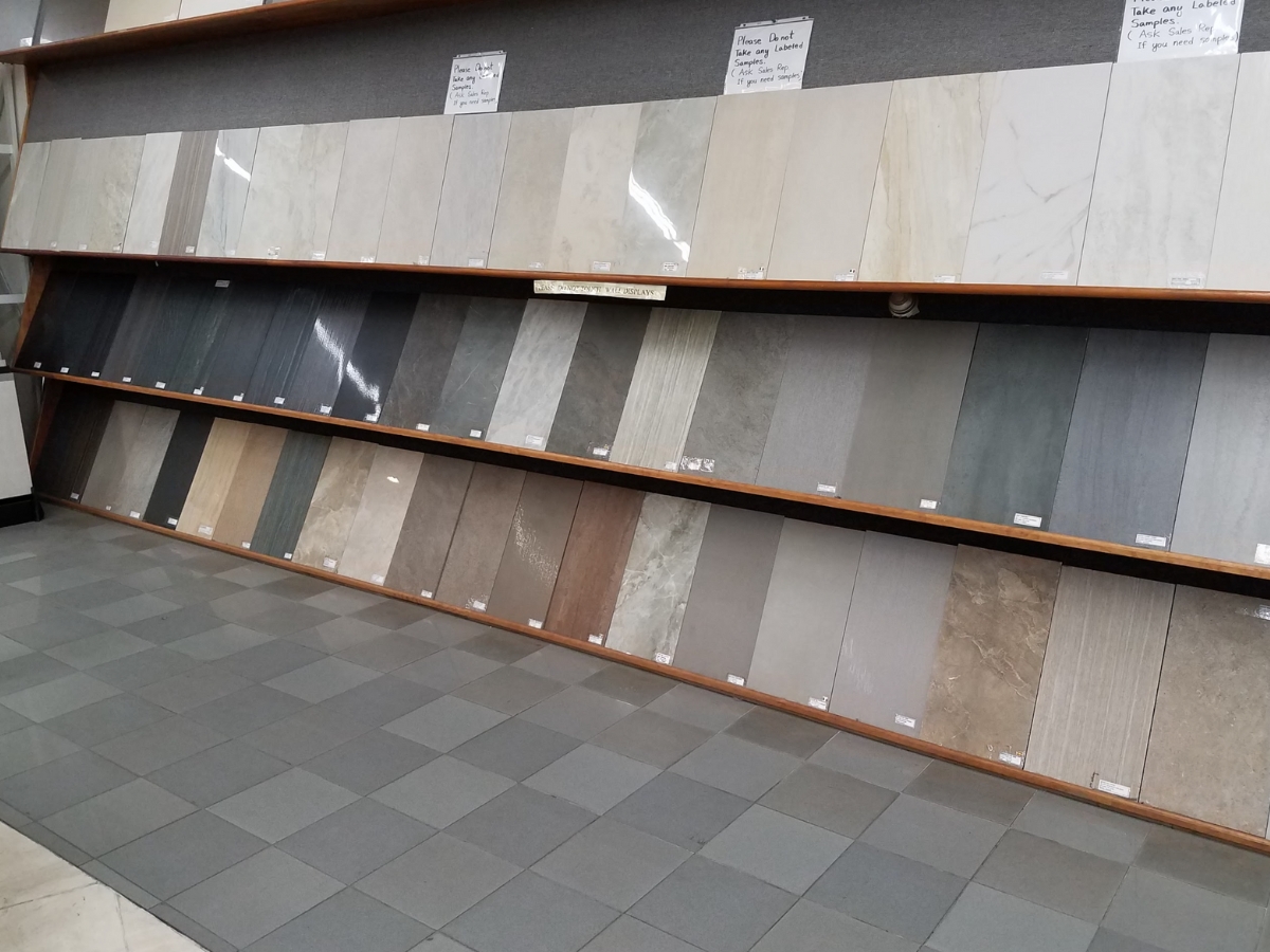 A display of various bathroom tiles in different colors and finishes, providing a wide range of options for bathroom renovations.