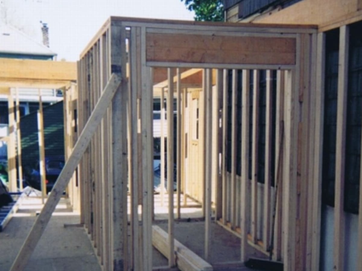 Newly constructed room addition with waterproofed framing and foundation.