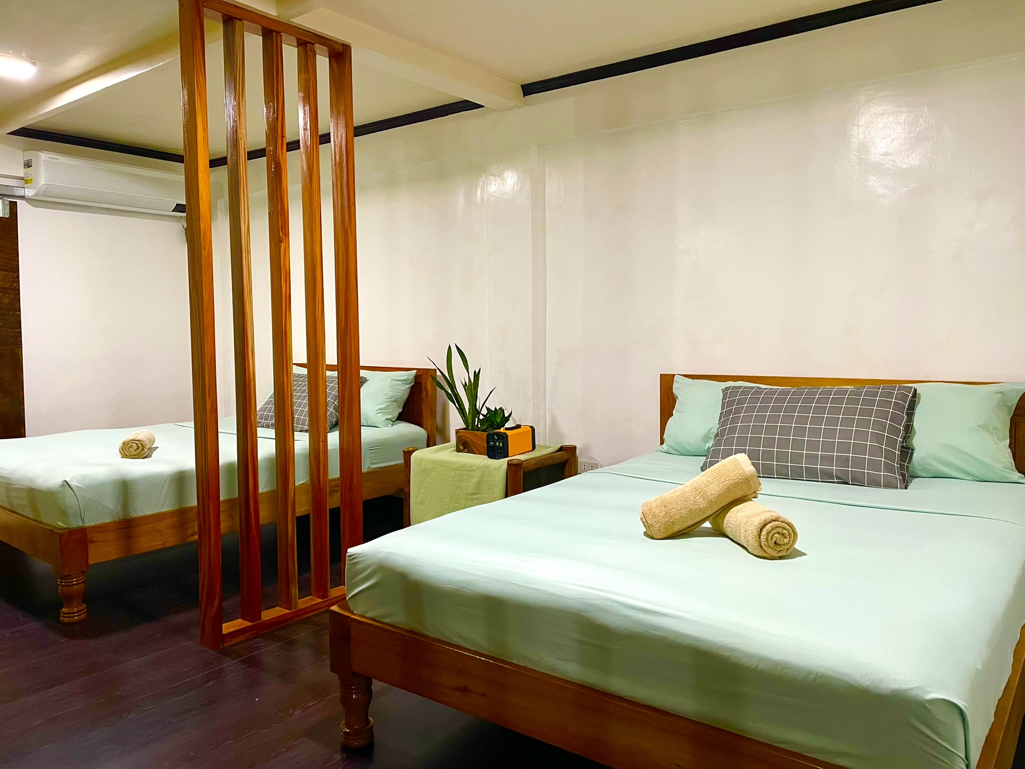 Beds in the Lower Unit at Tabskies Homestay Camiguin