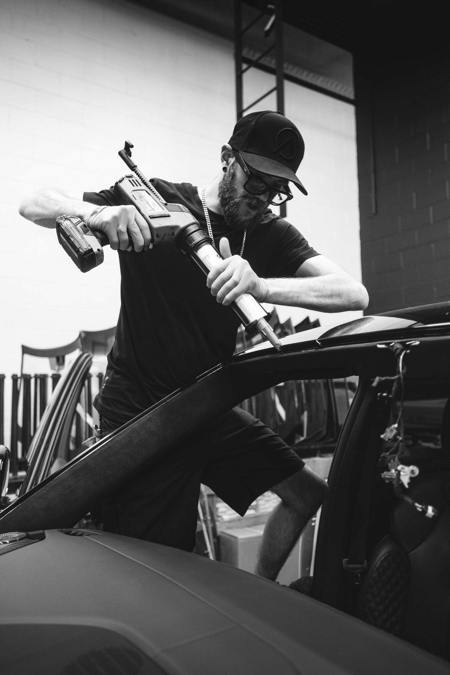 Auto glass technician at work