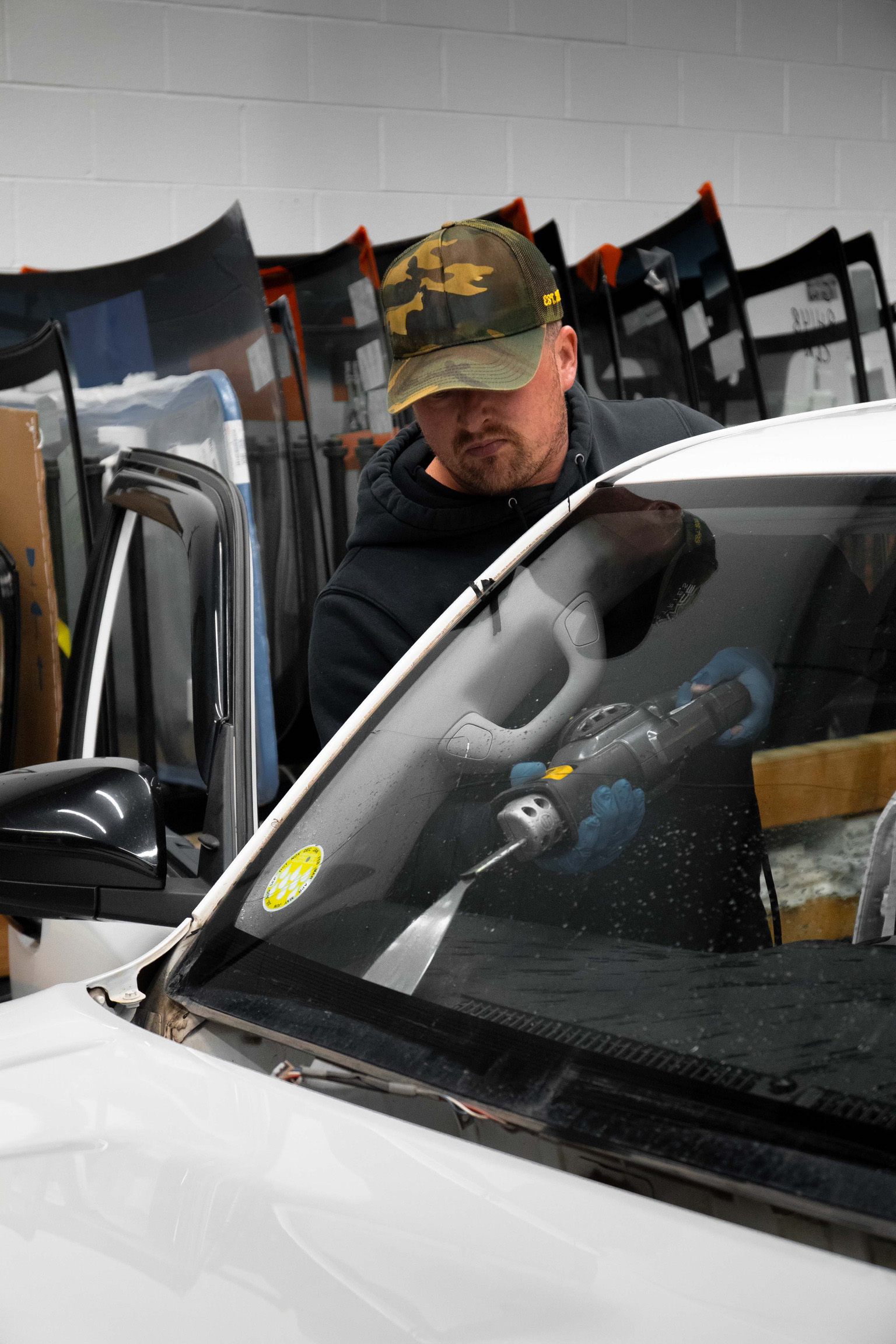 Auto glass technician at work