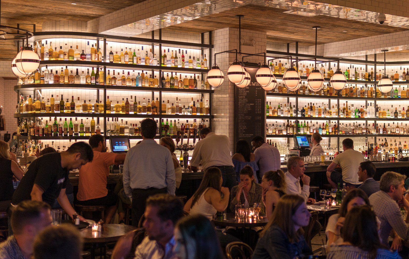 A busy, well-lit restaurant dining room during service