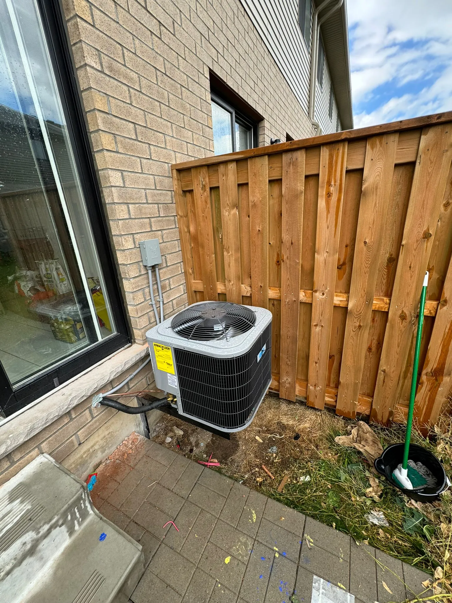 Outdoor AC equipment installed beside a property