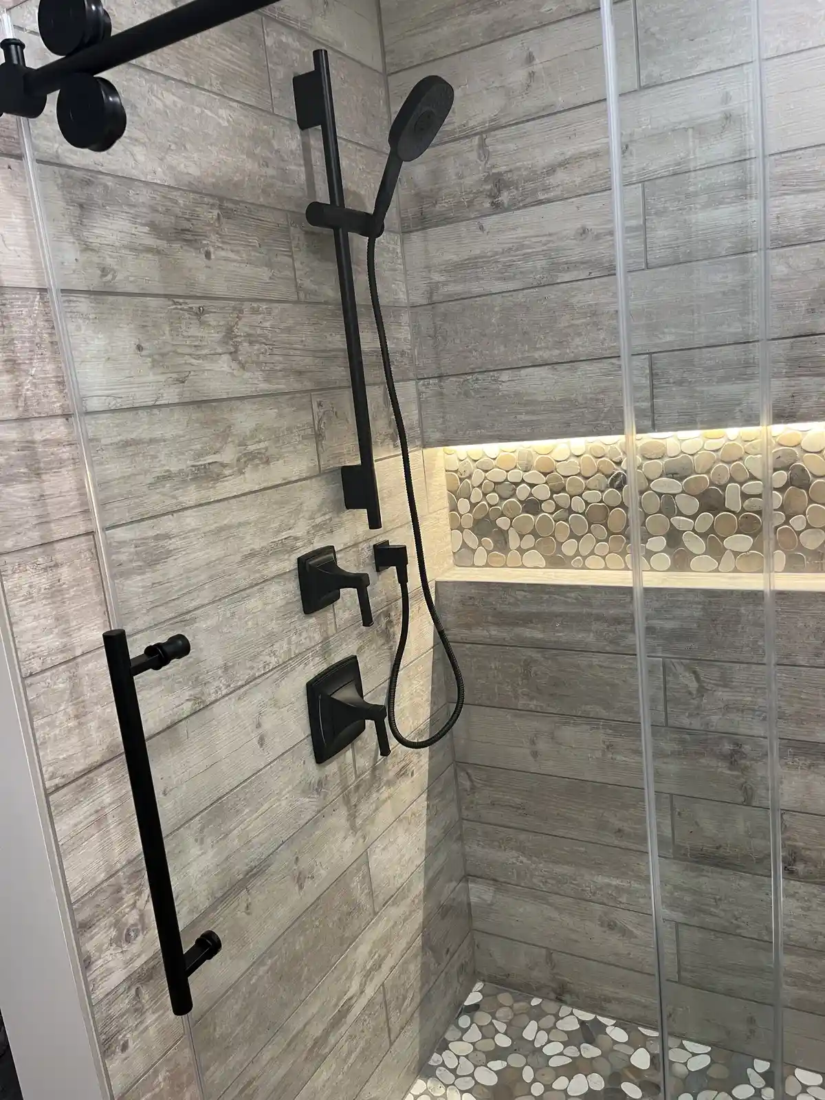 62 Candy Rd, Mohnton, PA 19540: A modern shower enclosure at 62 Candy Rd featuring wood-look tile walls, black by Webster ...